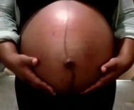 Watermelon shaped black pregnant belly