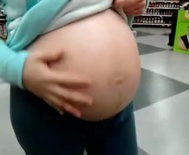 Pregnant woman out shopping for groceries
